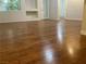 Spacious living room featuring hardwood floors, built-in shelves, and natural light, ready for personalization at 7620 Donald Nelson Ave, Las Vegas, NV 89131