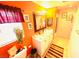 Bright bathroom featuring a double vanity, neutral tile, a window, and a colorful decor at 8156 Blue Hope Diamond Ln, Las Vegas, NV 89139