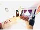 Bright bedroom with large window and a decorative hand fan on the wall at 8156 Blue Hope Diamond Ln, Las Vegas, NV 89139