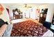 Large bedroom featuring carpet, a ceiling fan, and dresser with a mirror at 8156 Blue Hope Diamond Ln, Las Vegas, NV 89139