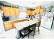 Bright kitchen with light cabinets, granite countertops, a center island and stainless appliances at 8156 Blue Hope Diamond Ln, Las Vegas, NV 89139