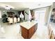 Stylish kitchen island with granite countertops and tile floors connect kitchen and dining areas at 8156 Blue Hope Diamond Ln, Las Vegas, NV 89139