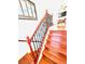 Staircase with wood steps and dark iron railing leading to an upstairs living area at 8156 Blue Hope Diamond Ln, Las Vegas, NV 89139