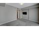 This bedroom has gray carpet and a television mounted on the wall at 8255 S Las Vegas Blvd # 2004, Las Vegas, NV 89123