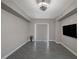 Bright open main bedroom with gray tile floors and modern ceiling fan at 8255 S Las Vegas Blvd # 2004, Las Vegas, NV 89123