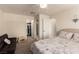 Cozy bedroom with neutral walls, carpet, ceiling fan, walk-in closet, and comfortable furnishings at 8600 W Charleston Blvd # 2187, Las Vegas, NV 89117