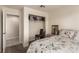 Well-lit bedroom with a closet, neutral walls, carpet, and a view into the bathroom at 8600 W Charleston Blvd # 2187, Las Vegas, NV 89117