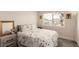 Comfortable bedroom with soft bedding, a window view, and a nightstand at 8600 W Charleston Blvd # 2187, Las Vegas, NV 89117