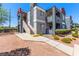 Well-maintained apartment complex with neat landscaping and exterior stairs leading to upper units at 8600 W Charleston Blvd # 2187, Las Vegas, NV 89117