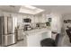 Well-equipped kitchen with stainless steel appliances, granite countertops, and open bar seating at 8600 W Charleston Blvd # 2187, Las Vegas, NV 89117