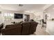 Bright living room with tiled floors, neutral colors, and a sliding door to the outside at 8600 W Charleston Blvd # 2187, Las Vegas, NV 89117