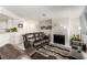Inviting living room with modern fireplace, comfortable seating, and open concept layout at 8600 W Charleston Blvd # 2187, Las Vegas, NV 89117