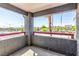 Outdoor patio with textured concrete, a red railing, and views of the neighborhood at 8600 W Charleston Blvd # 2187, Las Vegas, NV 89117