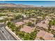 Expansive aerial view of the community, showcasing the lush landscaping, well-maintained streets, and tile rooftops at 8737 Red Brook Dr # 204, Las Vegas, NV 89128