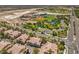 Lush aerial view of community near school and park with pools blends suburban living with convenience and access to amenities at 8737 Red Brook Dr # 204, Las Vegas, NV 89128