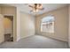 Neutral bedroom with carpet, ceiling fan and large window for natural light at 8737 Red Brook Dr # 204, Las Vegas, NV 89128