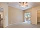 A bright bedroom with plush carpets and access to a private balcony at 8737 Red Brook Dr # 204, Las Vegas, NV 89128