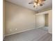 Neutral bedroom with carpet, ceiling fan and sliding closet doors at 8737 Red Brook Dr # 204, Las Vegas, NV 89128
