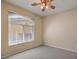 Neutral bedroom with carpet, ceiling fan and large windows for natural light at 8737 Red Brook Dr # 204, Las Vegas, NV 89128