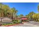 Redhills community entrance with lush landscaping and well-maintained gatehouse, offering a welcoming and secure environment at 8737 Red Brook Dr # 204, Las Vegas, NV 89128