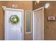 Entrance showing two white doors with gold hardware and wreaths, and marble address plates at 8737 Red Brook Dr # 204, Las Vegas, NV 89128