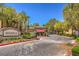 Community entrance with a Redhills sign and well-maintained landscaping, creating a welcoming first impression at 8737 Red Brook Dr # 204, Las Vegas, NV 89128