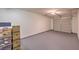 Clean garage with overhead door and plenty of room for storage at 8737 Red Brook Dr # 204, Las Vegas, NV 89128