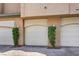 Multiple garages with manicured shrubbery at base of garage give a warm touch at 8737 Red Brook Dr # 204, Las Vegas, NV 89128