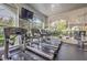 Bright gym with large windows, treadmills, elliptical machines, and free weights for a complete workout at 8737 Red Brook Dr # 204, Las Vegas, NV 89128