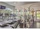 Well-equipped gym with treadmills, weight machines, and mirrored walls for a full-body workout at 8737 Red Brook Dr # 204, Las Vegas, NV 89128