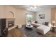 Bright living room featuring fireplace, ceiling fan, and sliding glass door to the patio at 8737 Red Brook Dr # 204, Las Vegas, NV 89128