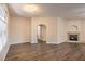 Bright, empty living room featuring a fireplace and hardwood floors at 8737 Red Brook Dr # 204, Las Vegas, NV 89128