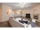 Open concept living room with fireplace, kitchen view, and modern furnishings at 8737 Red Brook Dr # 204, Las Vegas, NV 89128