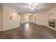 Spacious living room showcasing open floor plan, fireplace and hardwood floors at 8737 Red Brook Dr # 204, Las Vegas, NV 89128