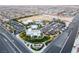 Aerial view of a nearby park with a swimming pool, community center, parking and fields near the neighborhood at 8941 Indigo Rose St, Las Vegas, NV 89166