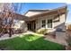 Outdoor living space with patio, pergola, built-in grill, and artificial turf, perfect for entertaining at 8941 Indigo Rose St, Las Vegas, NV 89166