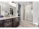 Modern bathroom featuring a glass enclosed shower, contemporary vanity, and stylish tile flooring at 8941 Indigo Rose St, Las Vegas, NV 89166