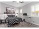 Contemporary bedroom boasting natural light, modern decor, and wood-look tile flooring throughout at 8941 Indigo Rose St, Las Vegas, NV 89166