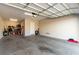 Spacious two-car garage with ample storage, overhead lighting, and sealed concrete flooring at 8941 Indigo Rose St, Las Vegas, NV 89166