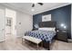 Main bedroom with an accent wall, wood-look floors, and an ensuite bathroom with a walk-in closet at 8941 Indigo Rose St, Las Vegas, NV 89166