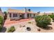 View of backyard, with desert landscaping, patio, and bench at 904 Big Horn St, Henderson, NV 89002