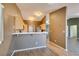 Charming kitchen with breakfast bar, wooden cabinets and stainless steel appliances at 904 Big Horn St, Henderson, NV 89002