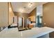 Well-lit kitchen features tile counters, wood cabinets, and stainless steel appliances at 904 Big Horn St, Henderson, NV 89002