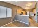 Charming kitchenette with breakfast bar, wooden cabinets and stainless steel appliances at 904 Big Horn St, Henderson, NV 89002