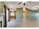 Spacious living room with tile floors conveniently flowing into the adjoining kitchen at 904 Big Horn St, Henderson, NV 89002