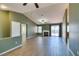 Spacious living room featuring vaulted ceiling, fireplace, tile floors and sliding glass doors at 904 Big Horn St, Henderson, NV 89002