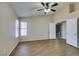 Spacious main bedroom with tile floors, neutral paint, and a ceiling fan at 904 Big Horn St, Henderson, NV 89002