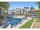Inviting pool area with a hot tub, lounge chairs, and manicured landscaping at 9050 W Tropicana Ave # 1015, Las Vegas, NV 89147