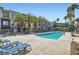 Community pool and lounge area showcasing modern design and resort-style amenities at 9050 W Tropicana Ave # 1015, Las Vegas, NV 89147