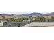 Mountainous landscape backdrop on a sunny day with palm trees in the foreground at 9050 W Tropicana Ave # 1015, Las Vegas, NV 89147